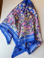 Angled display of scarf highlighting colours and drape