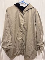 Front view of hooded coat on hanger