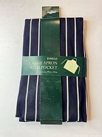Front view of packaged Jonelle navy striped apron