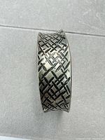 Full view of wide pewter cuff showing overall design and width