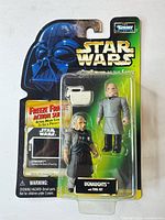 Front view of sealed Ugnaughts blister card showing two figures, accessory, slide