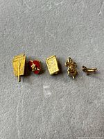 All five pins arranged side by side