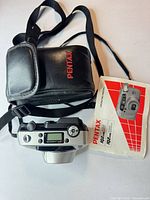 Camera, case, manual, strap overview