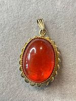 front view showing red cabochon and bezel