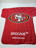 Front view of red terry cloth hand towel showing San Francisco 49ers logo and Brocade branding