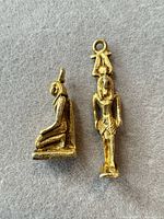 Front view of both pendants showing figures and gold-tone finish