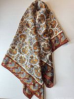Full view of folded scarf showing overall pattern and colours