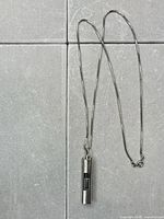 Full view of pendant watch on chain