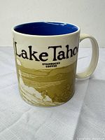 Front view showing Lake Tahoe text, landscape graphic, blue interior rim