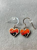 Front view of both heart enamel earrings showing colors and hooks