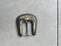 front view of sterling buckle showing gold overlay and engraving