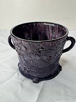 Full exterior view showing embossed pattern, handles and foot