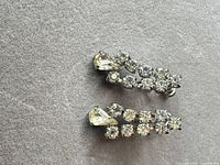 Front view of both earrings showing rhinestone arrangement and color
