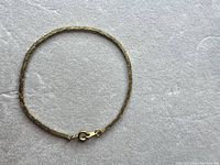Entire bracelet laid flat showing snake pattern and clasp