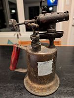 Left side view showing brass body, valves, burner head