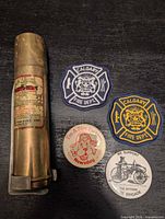 Full lot showing brass extinguisher, two patches, two button pins