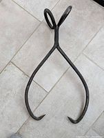 Full view of ice tongs showing size and form