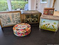 Group shot of five advertising tins