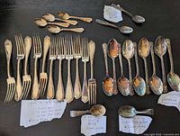 Overall view showing all forks and spoons with handwritten quantity notes