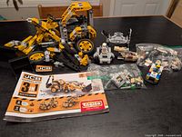 Engino JCB loader set, booklet and assorted LEGO builds and pieces