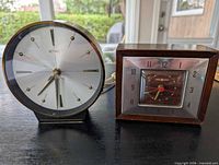 Both clocks side by side on tabletop