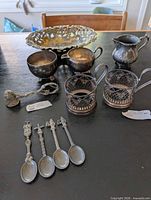 Group shot showing all metal items on table