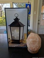 Boxed lantern next to salt rock