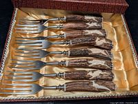 Full set of eight antler-handled forks in box