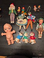 All eleven dolls laid out for scale and grouping