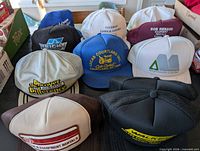 Group shot of all ten vintage trucker hats