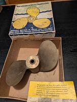 Propeller inside original box with lid and repair notice visible