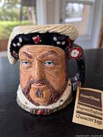 Front view of Henry VII character jug showing overall design and condition