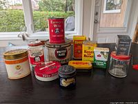 Group shot of all tins, jars and nutmeg chopper