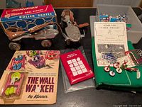 Lot overview showing roller skates, Subbuteo components, Wall Walker, Magnetic Match-Up