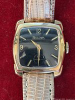 front view of Bulova watch showing dial and case