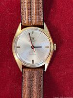 Front view of Tissot Seastar showing dial, hands, case and strap