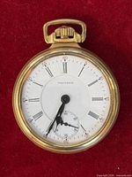 Front view of Waltham pocket watch showing dial details
