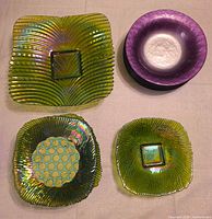 Group shot showing three green square platters and stack of purple bowls