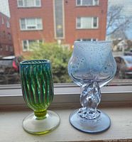 Front view of both goblets standing on windowsill