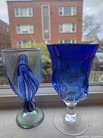 Front view of both goblets showing color and shape differences