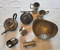 Overhead view of all eight silverplate items