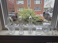 All six lead crystal pieces lined on windowsill