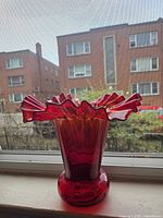 Full profile of vase on windowsill showing height, color gradient and footed base