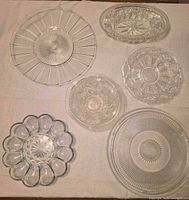 All seven glass pieces laid out on table