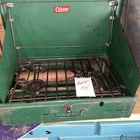 Stove closed showing overall wear and latch
