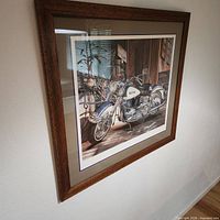 Front view of framed motorcycle print on wall
