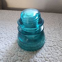 Front view of aqua glass insulator