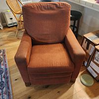 Front view of La-Z-Boy rust microsuede recliner showing overall form and upholstery