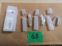 All three router bits with individual plastic cases and protective wraps displayed