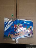 Front view of sealed Baby Shark decoration set showing character cutout graphics